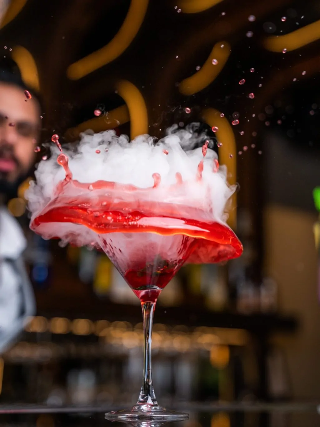 Red smoky cocktail glass at an indian affair bar